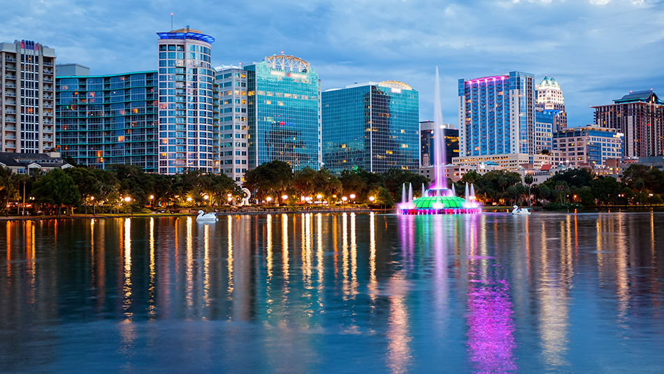 Orlando, Florida City Skyline on Lake Eola as Night Falls (logos blurred) Orlando 950